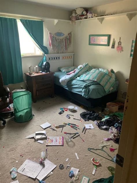 A Messy Bedroom With Lots Of Clutter On The Floor And Sheets Of Paper