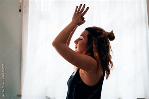 Close Up Of A Woman In A Yoga Position With Closed Eyes Clasped Hands