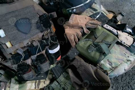 Army body armor, helmet and ammunition, Kalashnikov assault rifle with matrons and first aid ...