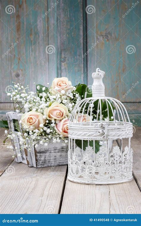 Vintage Birdcage Beautiful Pink Roses And Gypsophila Paniculata Stock