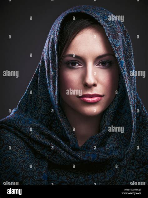 Portrait Of A Beautiful Mysterious Woman Wearing A Headscarf Stock