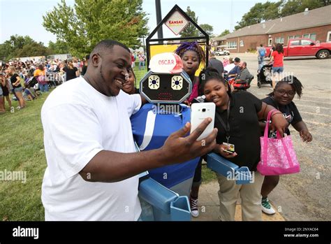 Coleman Middle School teacher Sean Gates takes a selfie with Oscar the ...