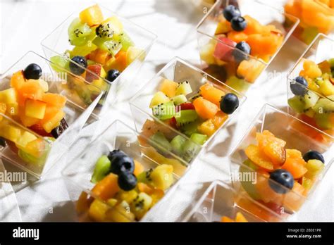 Catering Table With Fruit Salad Canape Stock Photo Alamy