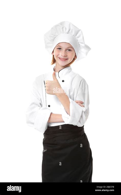 Cute girl in chef uniform on white background Stock Photo - Alamy