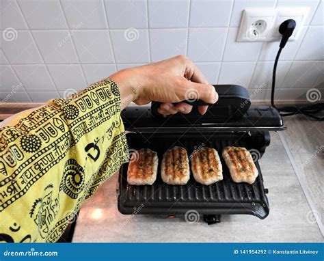 Cooking on the Electric Grill on the Table at Home Stock Photo - Image ...