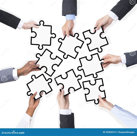 Group Of Business People Holding Pieces Of Puzzle Stock Photo Image