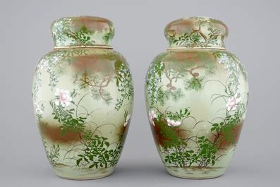 A Tall Pair Of Japanese Celadon Ground Vases With Covers Ca