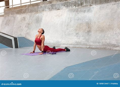 Workout Fitness Girl Stretching On Yoga Mat At Outdoor Stadium Fit Woman With Strong Muscular