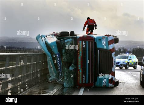 A Lorry Lies On Its Side After Being Blown Over In Strong Winds On The