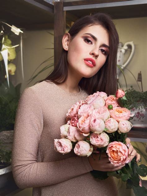 Young Beautiful Brunette Business Woman Florist Holding Trendy Bouquet