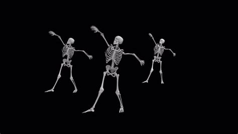 Three Dancing Skeletons On An Isolated Black Background Stock Video