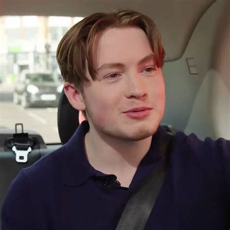 a man sitting in the back seat of a car