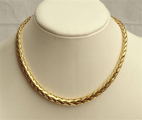 Collier en or jaune 18K 750 00 maille épi L 40 cm P 28 g Vente