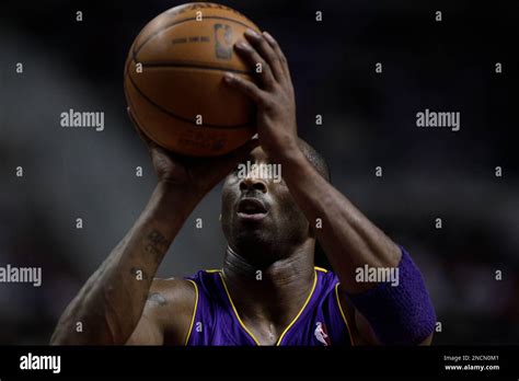 Los Angeles Lakers Shooting Guard Kobe Bryant 24 Shoots Against The Detroit Pistons In The