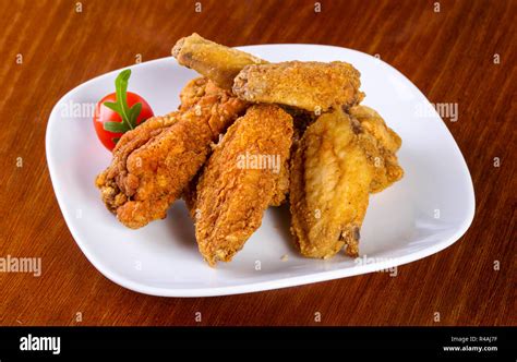 Chicken Wings Heap Served Cherry Tomato Stock Photo Alamy