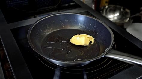 Premium Photo Black Pan With Butter On Hotplate In The Restaurant