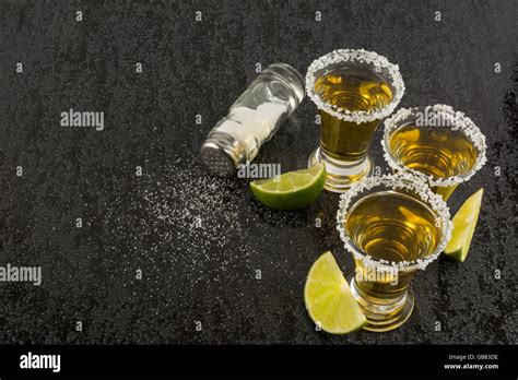 Tequila Shots With Lime And Salt On Black Table Tequila Gold Mexican