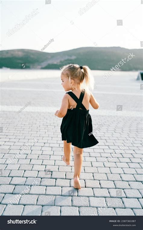 Little Girl Walks Barefoot On Tiled Stock Photo 2387361087 | Shutterstock