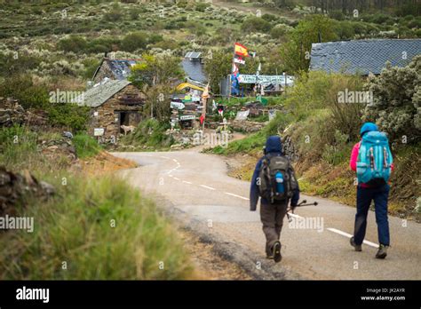 Pilgrims Walking Camino De Santiago In The Manjarin Village Spain