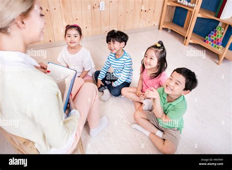 Kindergarten Children With Foreign Teacher Stock Photo Alamy