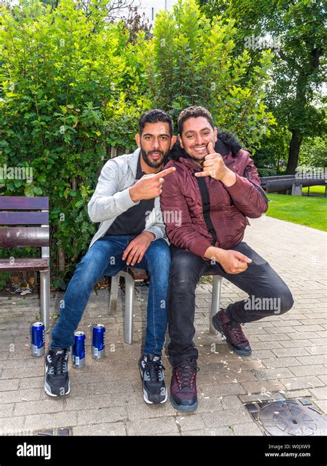 Young men bonding - Saint-Gilles, Brussels, Belgium Stock Photo - Alamy