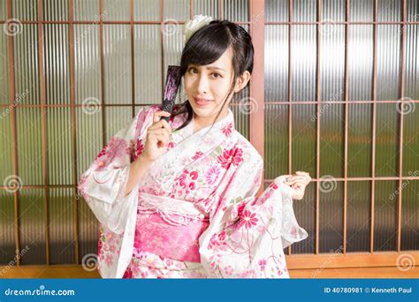 Asian Woman Wearing A Kimono In Front Of Japanese Stock Image Image