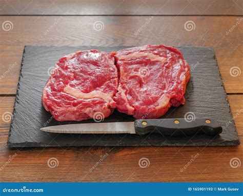 Two Fresh Rib Eye Steaks On A Slate Plate Stock Image Image Of Rare