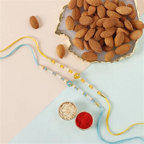 Send Sneh Vibrant Set Of Pearl Rakhis Almonds Online Rakhibazaar