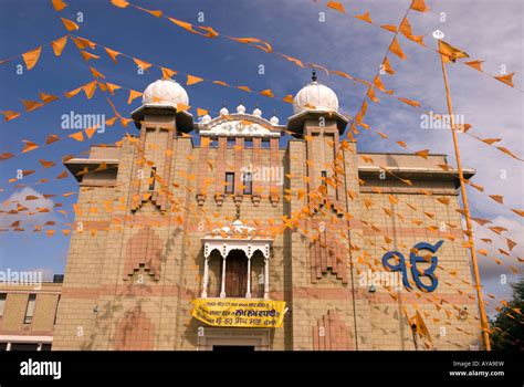 Facade Of Sikh Temple Adorned With Flags For Festival Of Vaisakhi Sri