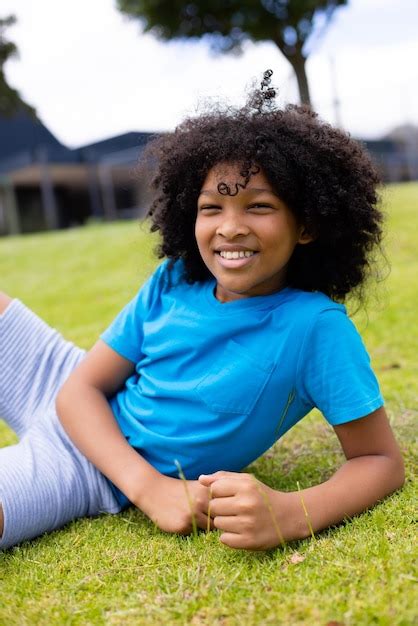 Premium Photo Portrait Of Happy African American Schoolboy Sitting On