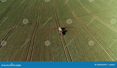 Tractor Spray Fertilize On Field With Chemicals In Agriculture Field