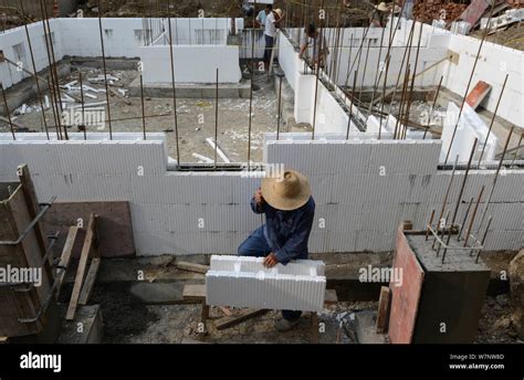 File Chinese Workers Build A House With Molded Expanded Polystyrene