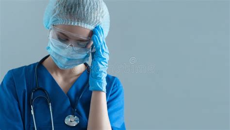 Paramedic In A Blue Medical Uniform Sitting In An Ambulance Car Stock