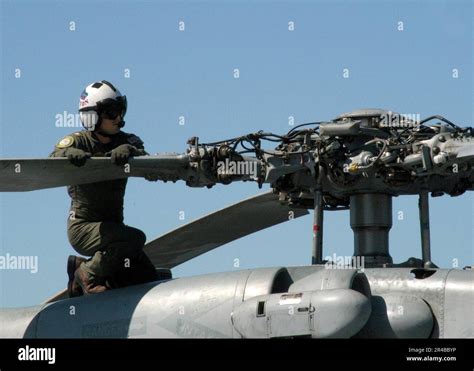 US Navy U S Navy Lt Cmdr Checks The Rotor Head Of An SH 60F Seahawk