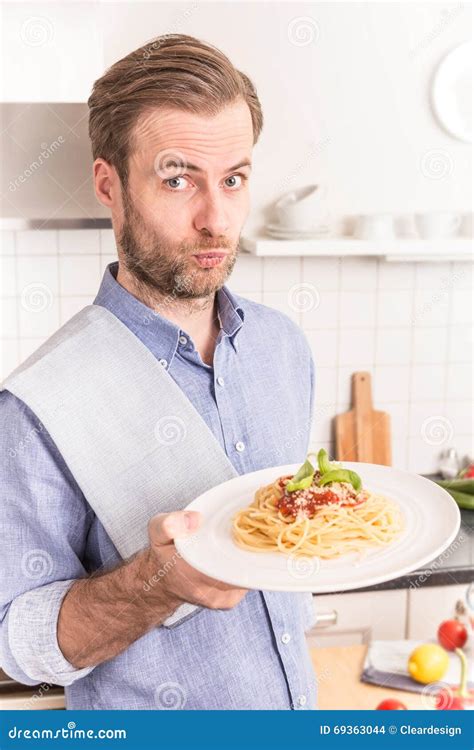 Happy Smiling Man Or Chef Holding Plate With Spaghetti Stock Photo