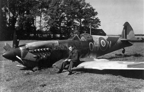 A Polish Pilot Of No302 Squadron Sits On The Wing Of A Spitfire After Its Crash From A Training