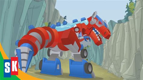 Optimus Prime S Primal Mode T Rex Official Clip Rescue Bots Season