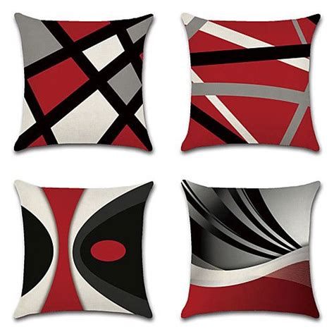 Four Red And Black Pillows With Abstract Designs On Them Each One In