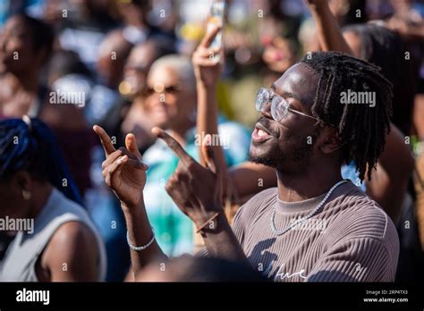 A Spectator Enjoys The Black On The Square Festival In Trafalgar Square