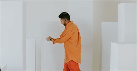 Man In An Orange Shirt Walking · Free Stock Photo