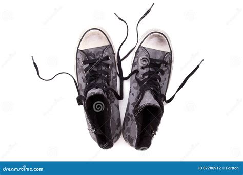 Zapatillas De Deporte Del Vintage En Un Fondo Blanco Foto De Archivo