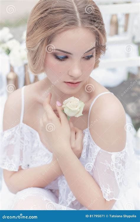 Beautiful Young Sweet Blonde Girl With Wedding Bouquet In The Hands Of