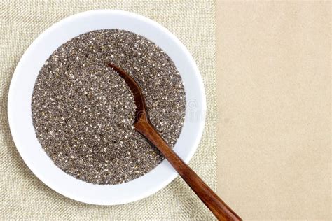 Healthy And Diet Food Chia Seeds Or Superfood In White Bowl On Linen