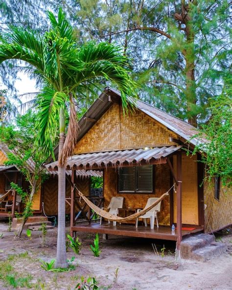 Premium Photo | Bamboo hut bungalows on the beach in thailand