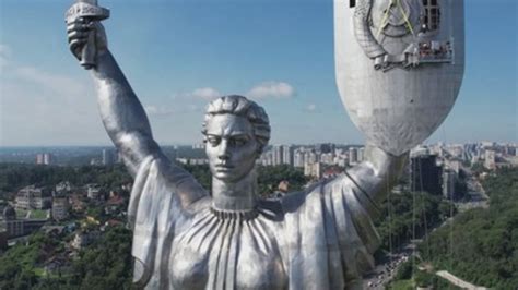 Ukraine removes Soviet symbols from Motherland Monument in Kyiv