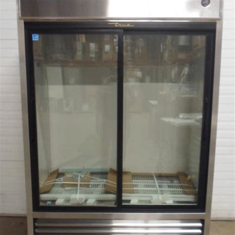 Two Glass Doors On The Front Of A Commercial Refrigerator