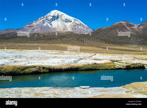 Hot springs in Sajama National Park with Sajama Volcan in the ...