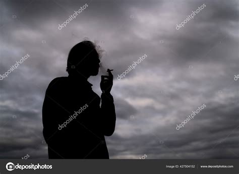 Silhouette Guy Smoking Blunt