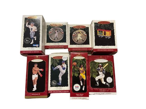 Lot 8 Hallmark Keepsake Ornaments Including Muhammad Ali Satchel Paige Lou Gehrig Nolan