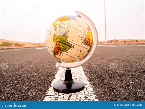 Closeup Shot Of A 3d Globe Model In The Road With A Blurred Background